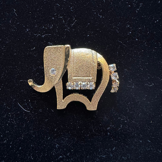 Vintage gold elephant pin with rhinestone accents