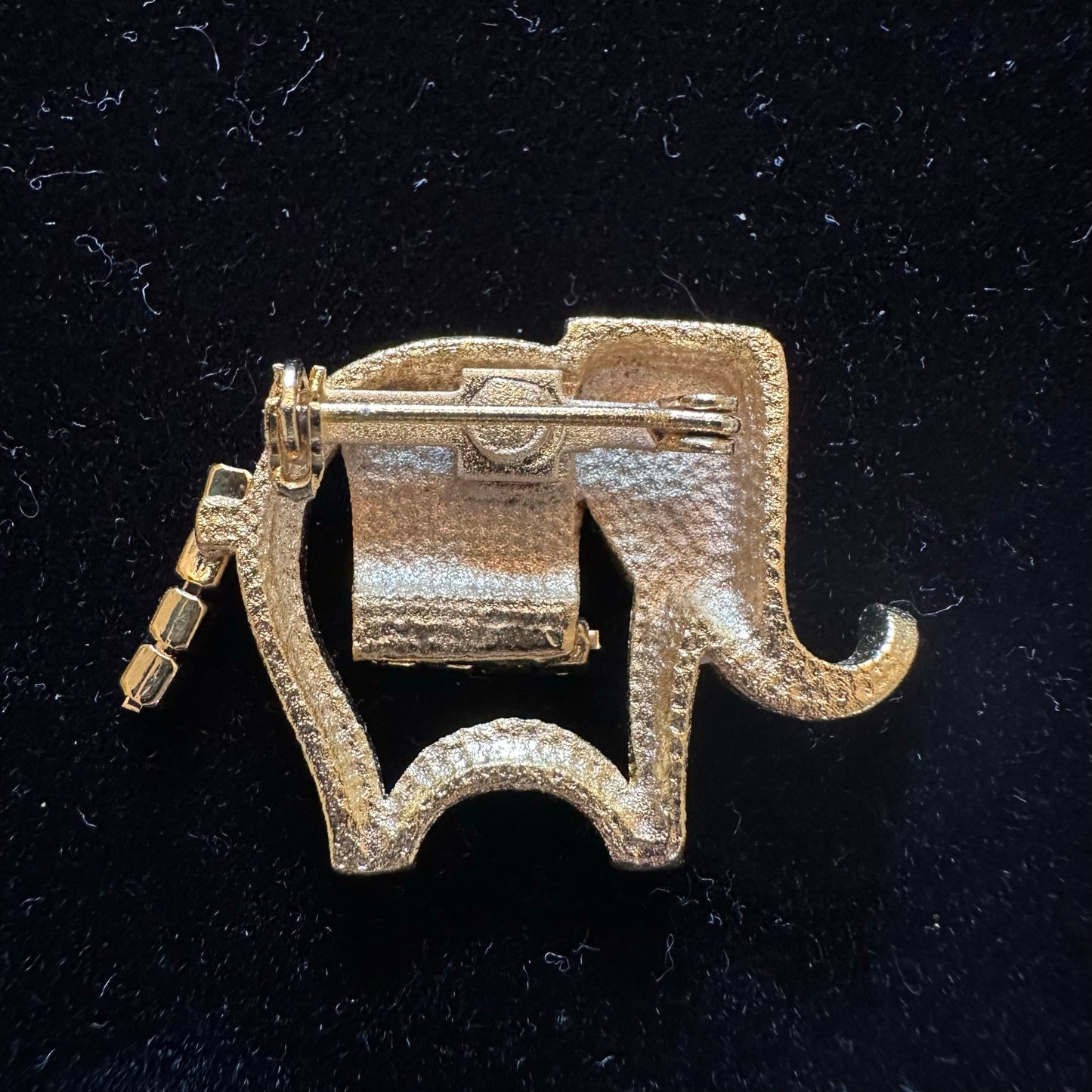 Vintage gold elephant pin with rhinestone accents